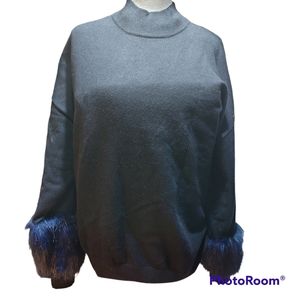 Ellos black sweater with blue furry sleeves.